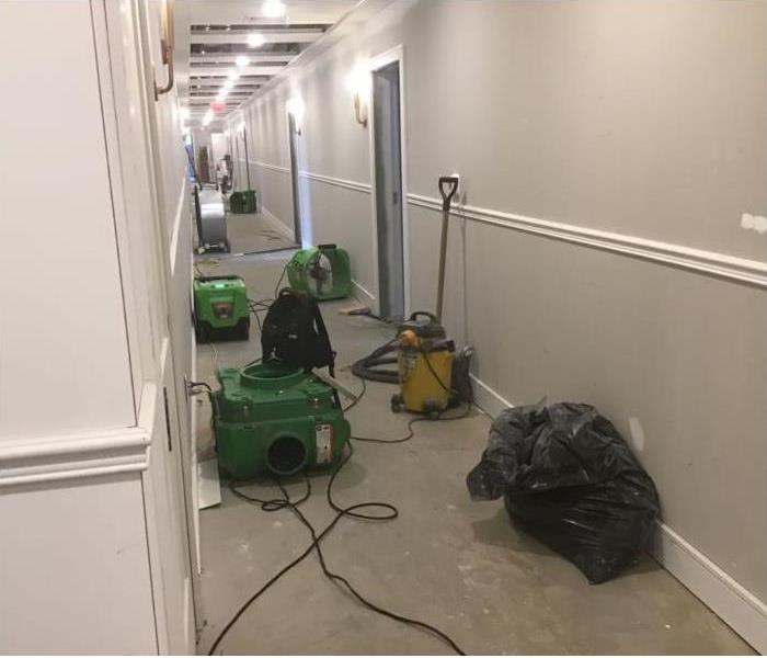drying equipment in hallway of residential building