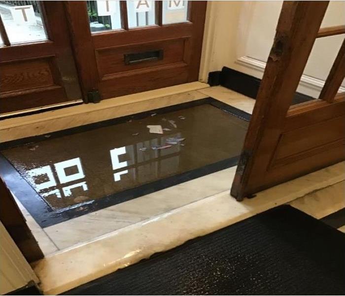 wet floor in entrance of building