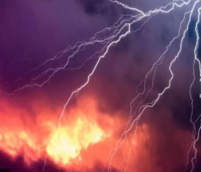 lightning bolt and fire in the sky during storm
